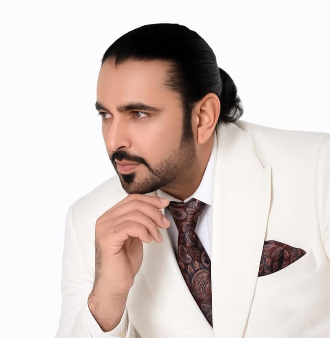 Editorial portrait of Syed Mudassar Khushnood in cream suit